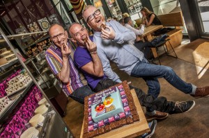 Konditor & Cook, present a Bert and Ernie cake to the founders of The Quest Program, to celebrate the launch of the Fudgepacker Brownie Fundraiser.